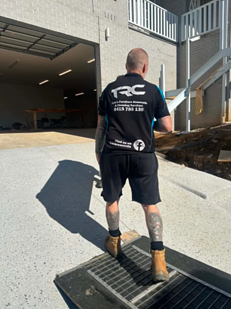 Uniformed Trev's Removals mover arriving on site in Melbourne