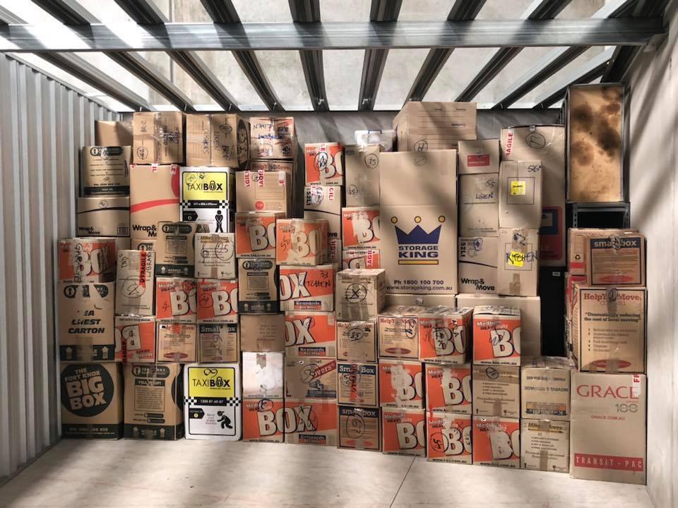 Professionally packed moving boxes stacked in storage unit - Trev's Removals Melbourne